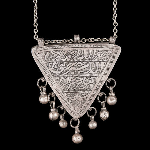 Necklace with triangular amulet container
