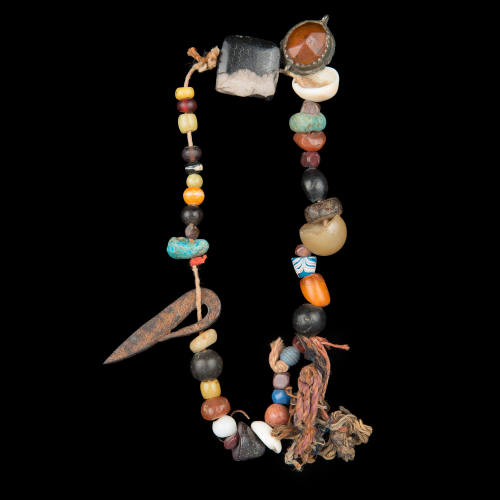 Talismanic beads with a miniature iron dagger
