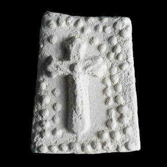 Sacred clay tablet with crucifix surrounded by small flowers