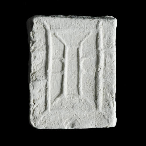 Sacred clay tablet with linear geometric design depicting a cross contained inside an upright rectangle