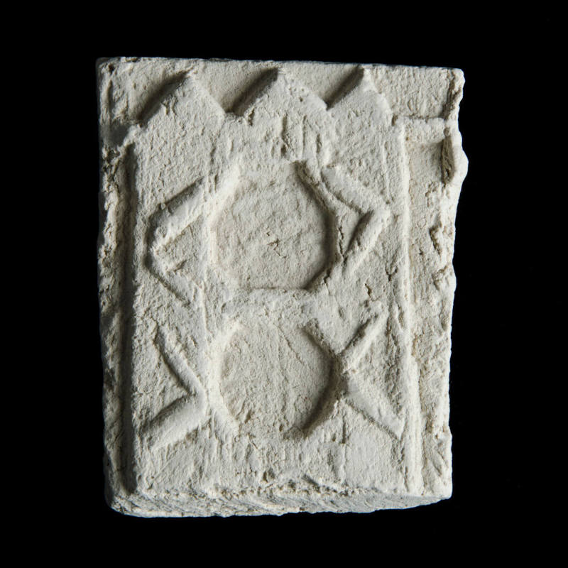 Sacred clay tablet with vertical geometric design