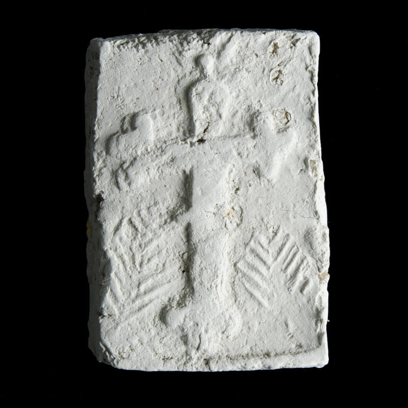 Sacred clay tablet with large cross in center