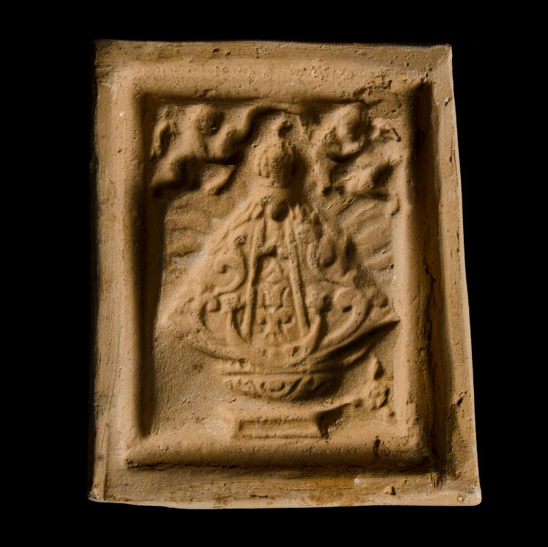 Sacred clay tablet mold of Virgin with faint rays