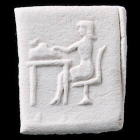 Impressed clay tablet votive offering with woman typing