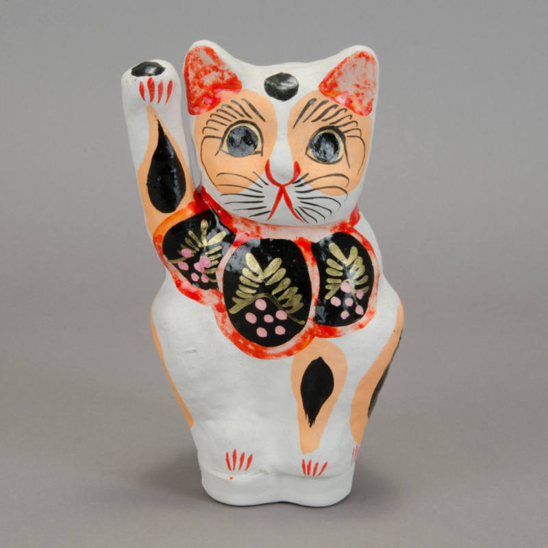 Maneki Neko (beckoning cat) figurine
