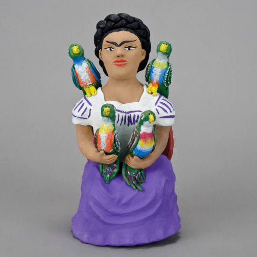 Frida Kahlo with birds figurine