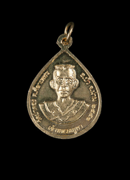 Thai Buddhist amulet with an image of a King