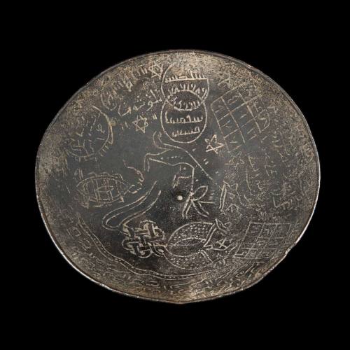 Mystical bowl inscribed with magical motifs and squares containing Arabic writing