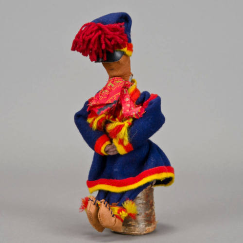 Male Doll Sitting on Birch Stump