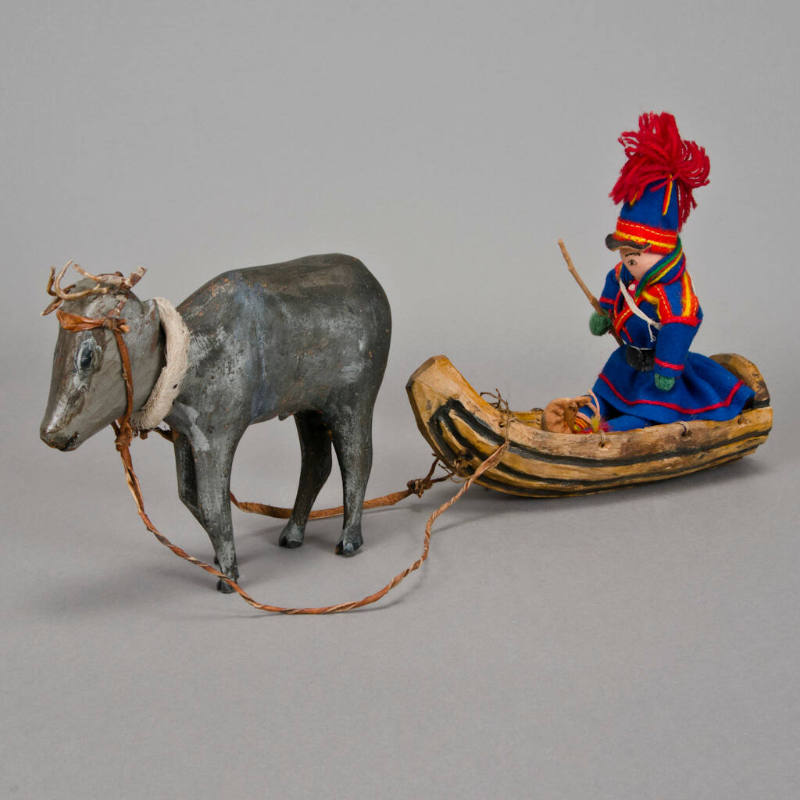 Male Doll in Reindeer-Drawn Sled