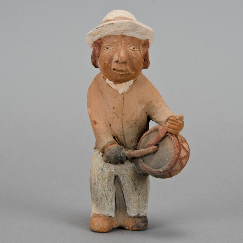 Figural whistle, man playing drum