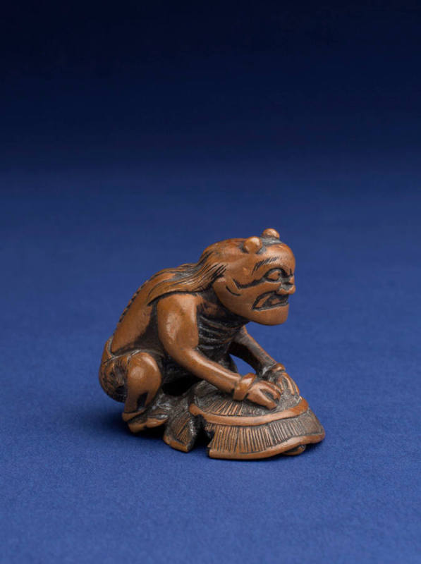 Netsuke in the form of an Oni (Demon) containing Shoki the Demon-Queller