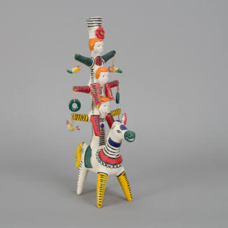 Candleholder, tower of people on donkey