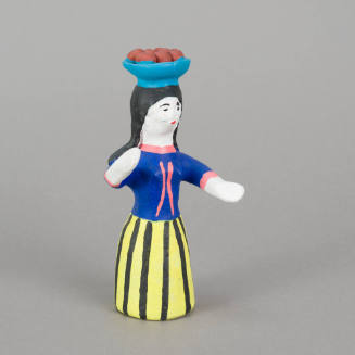 Figure, woman with bowl of fruit on head