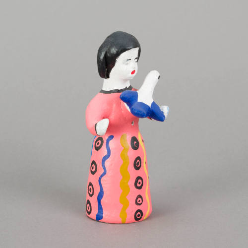 Figure, woman holding bird