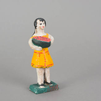 Figure, woman holding melon slice