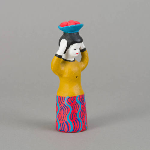 Figure, woman with bowl of fruit on head