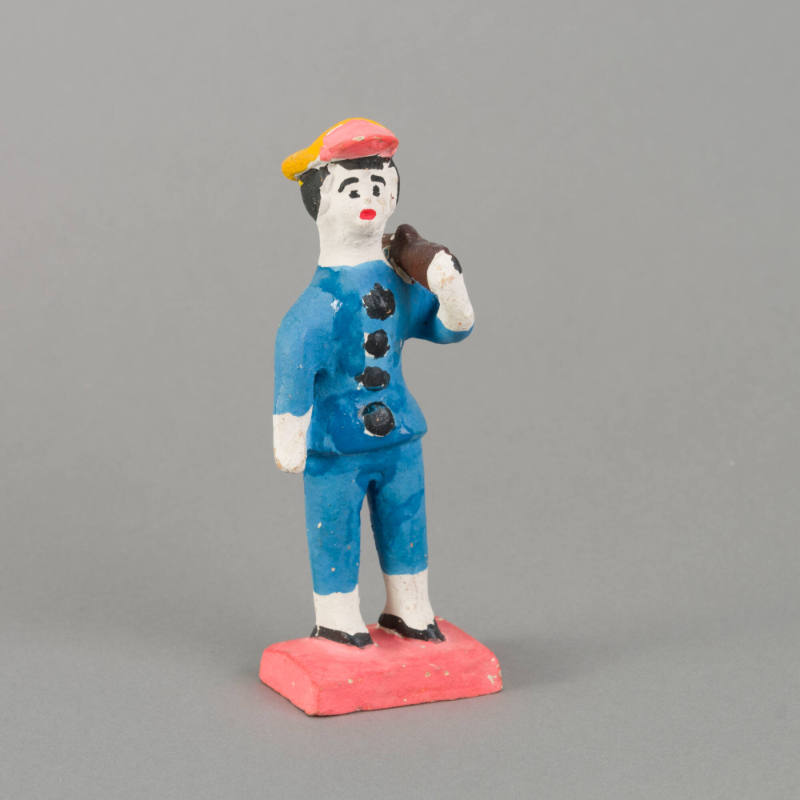 Figure, man with rifle on shoulder