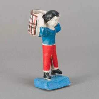 Figure, man carrying basket on back