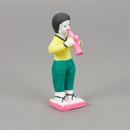 Figure, horn player