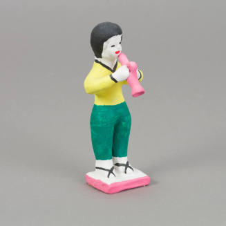 Figure, horn player