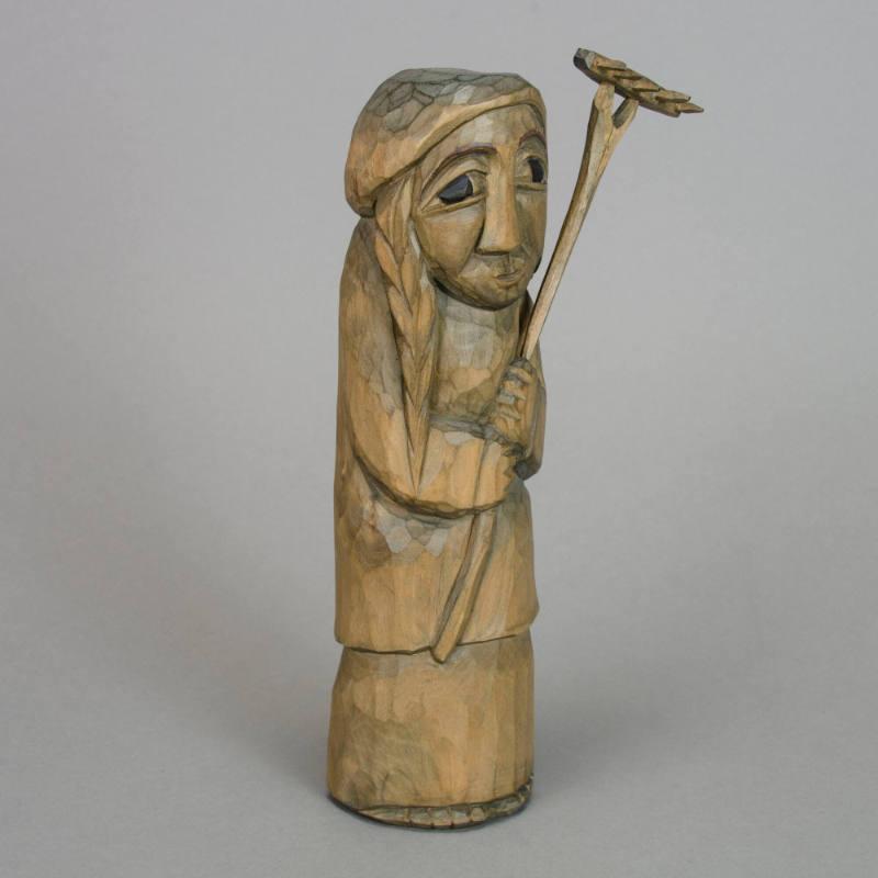 Woman with rake figurine