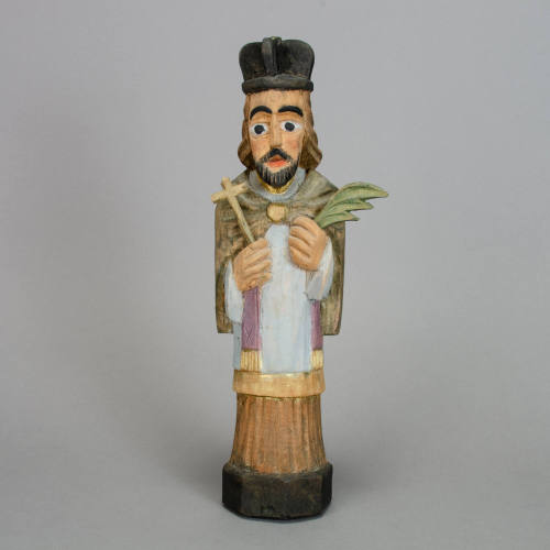 Priest with biretta, cross and palm frond figurine