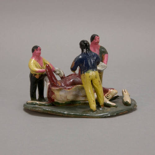 Men slaughtering bull figure