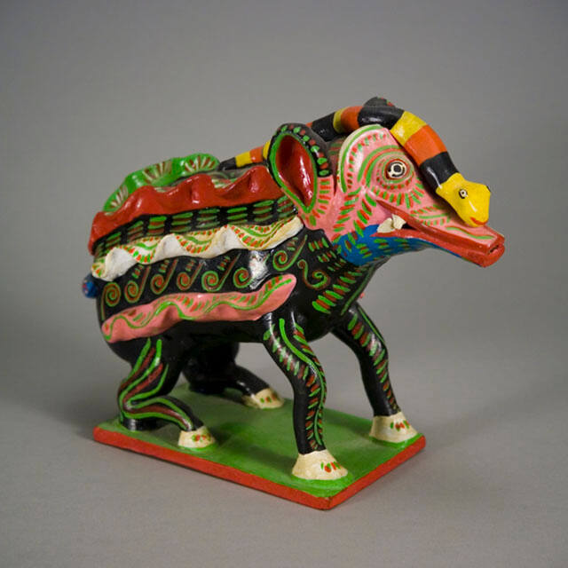 Fantasy ceramic creature with snake