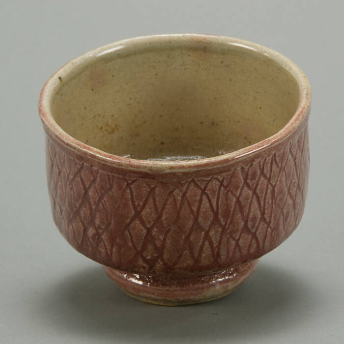 Stoneware High Foot Tea Bowl with strawberry glaze.
