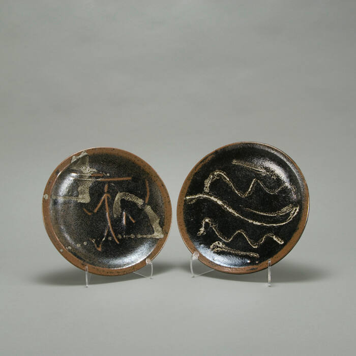 Pair of black/brown glazed plates