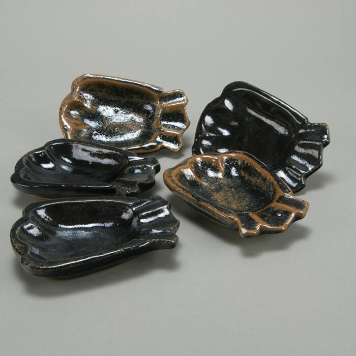 five small fish shaped dishes