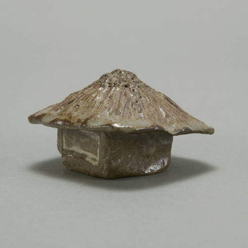 Small house-shaped box with roof as lid