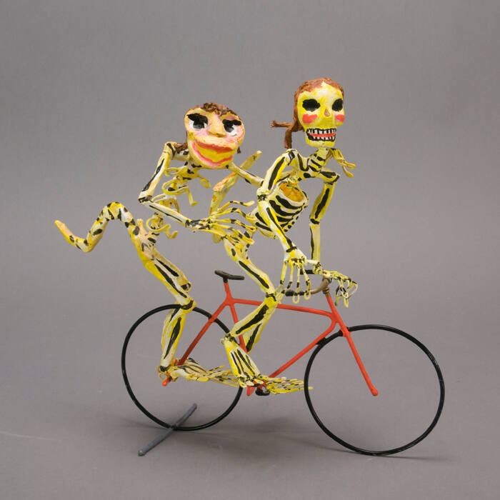 Sculpture, skeletons on bicycle