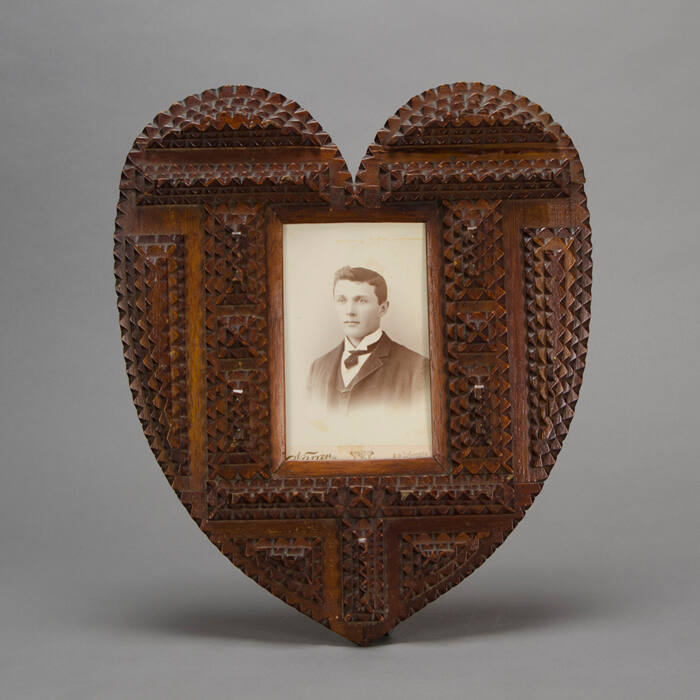 Heart-shaped tramp art frame with cabinet card