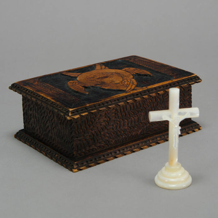 Burned wood box with angel, crucifix inside