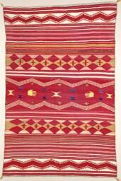 A classic style Navajo blanket. Colors are red, yellow, light green, dark blue, white; made of …