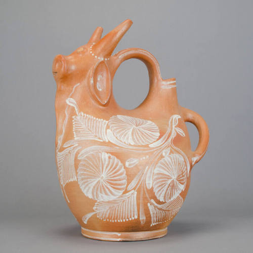 Bull jug with white floral pattern