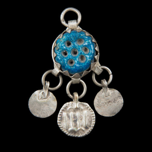 Amulet worn by a young boy to protect him from the evil eye