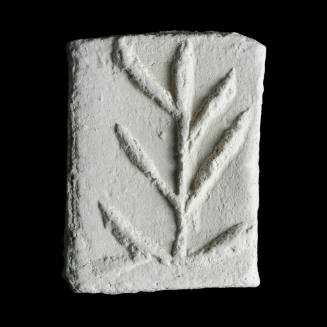 Sacred clay tablet with plant form 