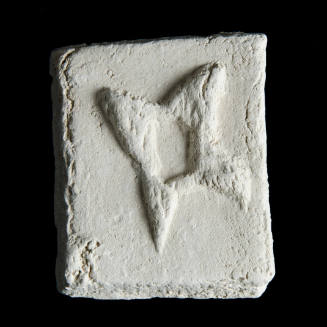 Sacred clay tablet with hollow four-pointed star leaning to left in center