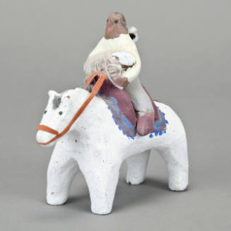 Shepherd on horse figurine