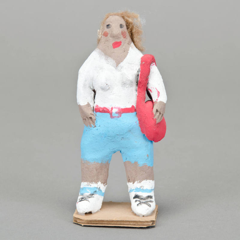 Woman with red purse figurine