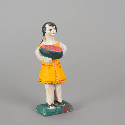 Figure, woman holding melon slice