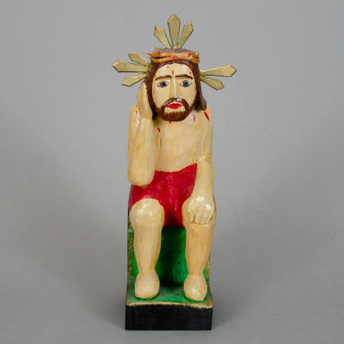 Pensive Christ figurine