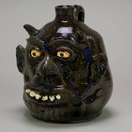 Devil face jug