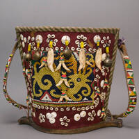 Baby carrier with protective dragon figure