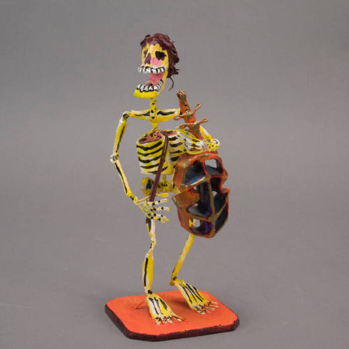Skeleton with cello sculpture