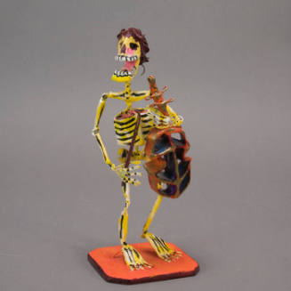 Skeleton with cello sculpture