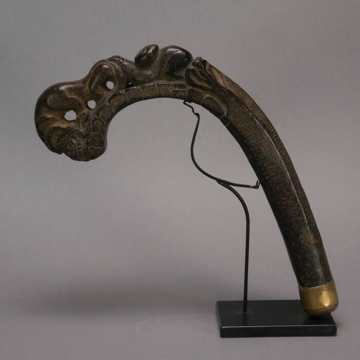 Sickle handle, lion and prey